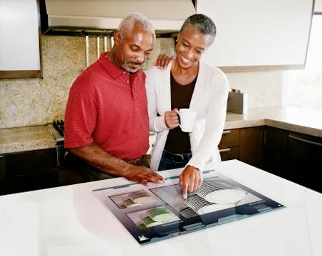 Couple using computer in table 写真素材