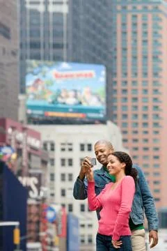 Couple using digital camera Stock Photos