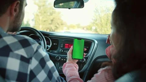 Couple using digital map application while travelling together. Slow motion Stock Photos