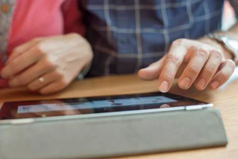 Couple using digital tablet, cropped Stock Photos