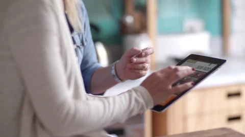 Couple using digital tablet for online banking Stock Footage 63283756