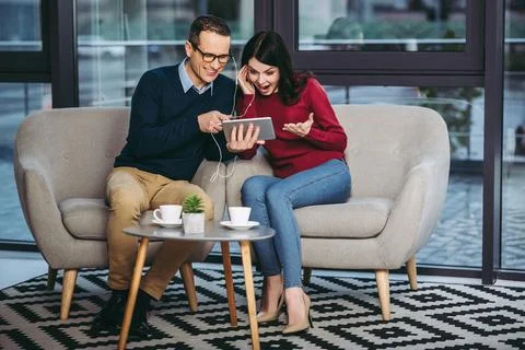 Couple using digital tablet Stock Photos