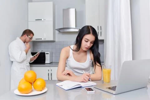 Couple using gadgets and planning day Foto stock