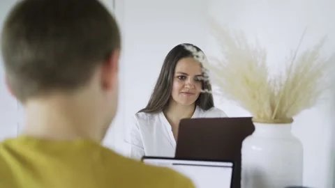 Couple using gadgets and talking at breakfast Stock Footage 148019922