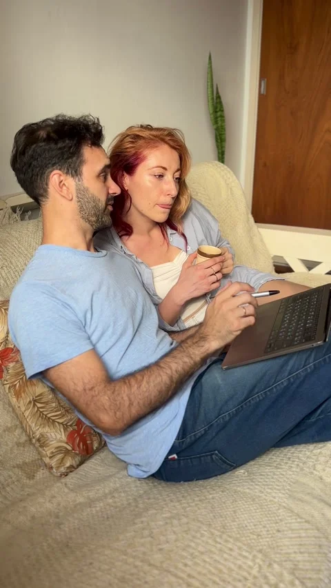 Couple using laptop Stock Footage 303828900