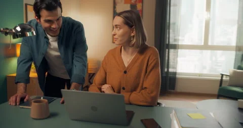 Couple Using Laptop at Home Cinema Robot Footage Stock Footage 320883961