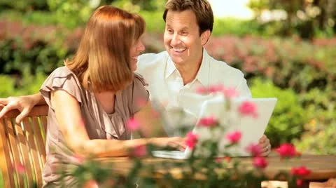Couple Using Laptop Outdoors Stock Footage 11409699