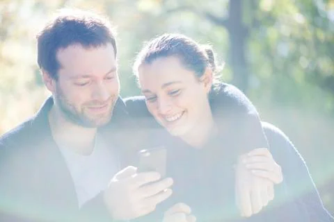 Couple using mobile app on smartphone for navigation Stock Photos