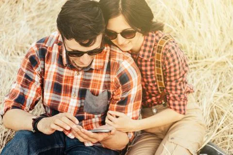 Couple is using the mobile phone Stock Photos