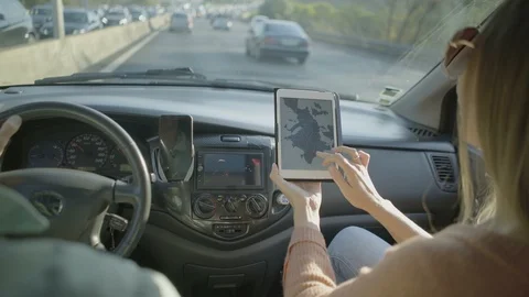 Couple using navigation app in car Stock Footage 107401595