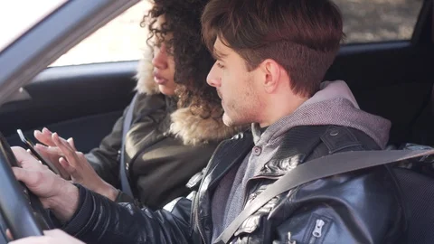 Couple using navigation on mobile phone during car road trip Stock Footage 100246174