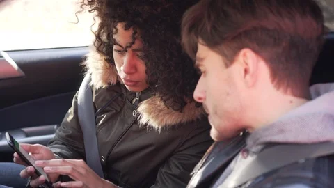 Couple using navigation on mobile phone during car road trip Stock Footage 100246242