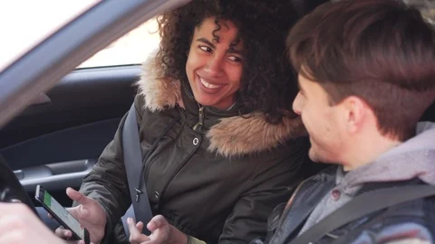 Couple using navigation on mobile phone during car road trip Stock Footage 100246289