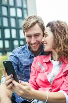Couple using smartphone to take a selfie Stock Photos