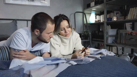 Couple Using Smartphones In Bed At Night Stock Footage 128545577