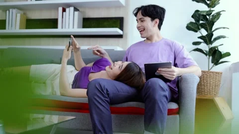 Couple using tablet and smartphone Stock Footage 245076985