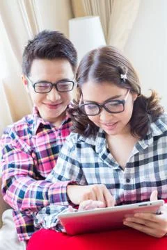 Couple using tablet Stock Photos