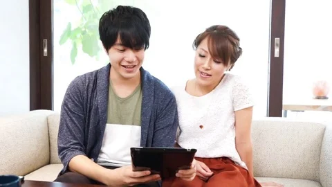 Couple using a tablet（pad） terminal Stock Footage 72558340