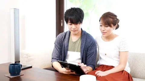 Couple using a tablet（pad） terminal Stock Footage 72559387