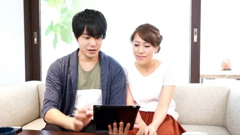 Couple using a tablet（pad） terminal Stock Footage 72559521