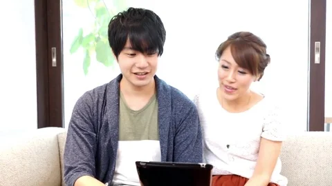 Couple using a tablet（pad） terminal Stock Footage 72559523