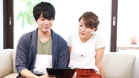 Couple using a tablet（pad） terminal Stock Footage 72559568