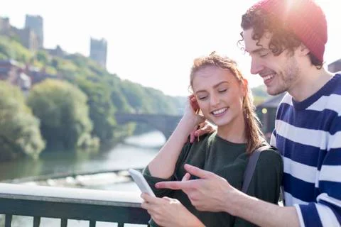 Couple using Technology Outdoors Stock Photos