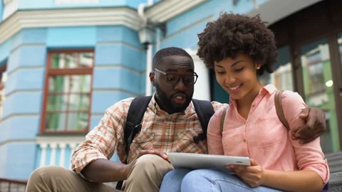 Couple using travel guide application tablet, educational program for students Stock Footage 91786111