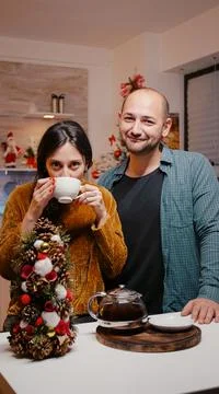 Couple using video call communication on christmas eve 写真素材