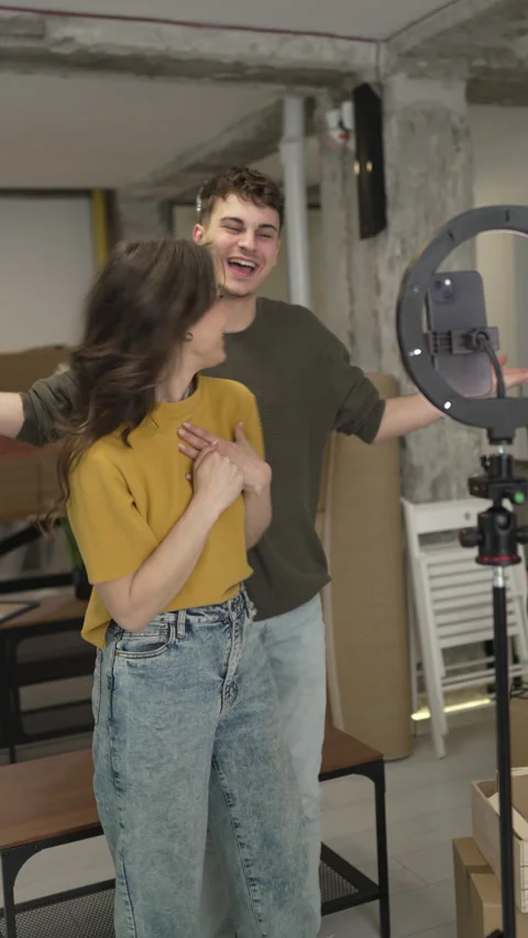 Couple v-loggers use mobile phone and ring light for record video Stock Footage 309002494