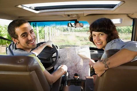 Couple in vehicle with map Fotos Stock
