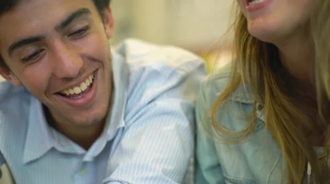 Couple viewing amusing online content on digital tablet Stock Footage 63305417