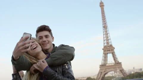 Couple visiting the Eiffel tower and taking selfies with each other. Stock Footage 63030899