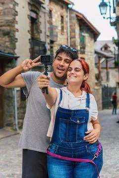 Couple vlogging with action camera while doing rural tourism in a mountain .. Stock Photos