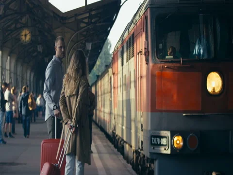 Couple Waiting The Arrival Of The Train Stock Footage 78769822