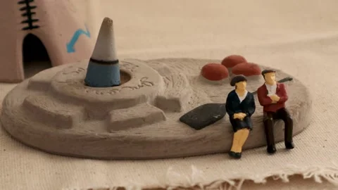 A couple waiting in front of incense Stock Footage 236435035