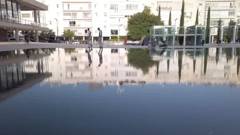 Couple walk around decorative pool Stock Footage 117140733