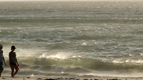 Couple walk on beach Stock Footage 58877858
