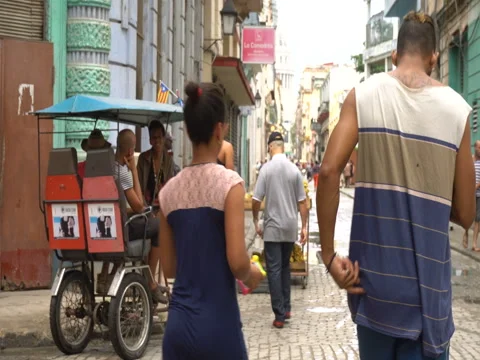 Couple walk down the street Stock Footage 70845028