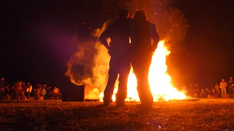Couple Walk Up To Large Burning Fire Stock Footage 2975755