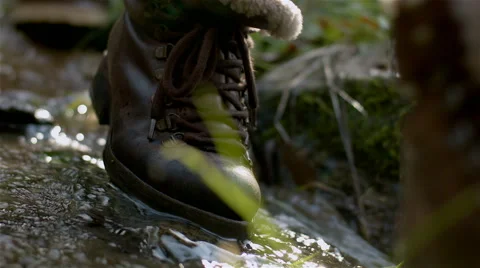 A couple walk on side of a river. Stock Footage 63068248
