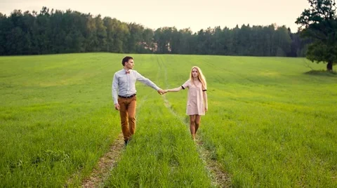 Couple Walking Across Meadow Stock Footage 43570524