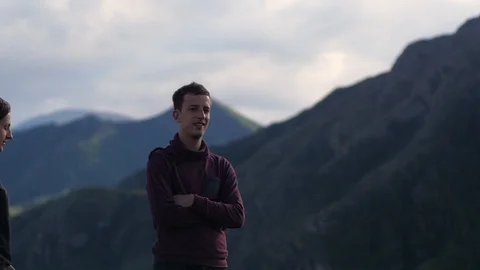 Couple walking against the backdrop of the mountains. Honeymoon. kiss on the Stock Footage 105983243