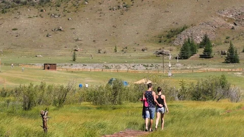 Couple walking against the backdrop of the mountains. Honeymoon. man and woman 스톡 동영상 106102406