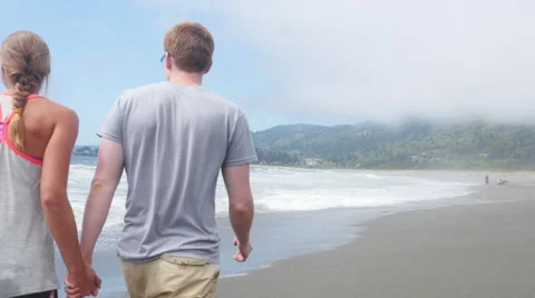 Couple walking along the beach Video stock 67297978