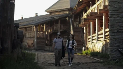 Couple walking along the path Stock Footage 82365278