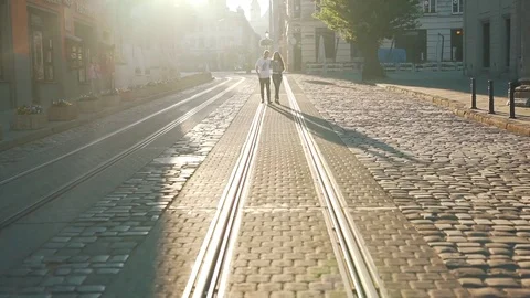 The couple is walking along the tramway Stock Footage 79113341