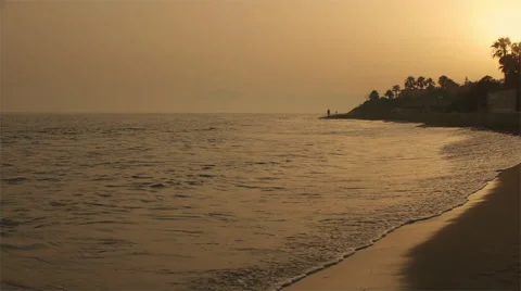 Couple walking on beach at dusk. Stock Footage 43654478