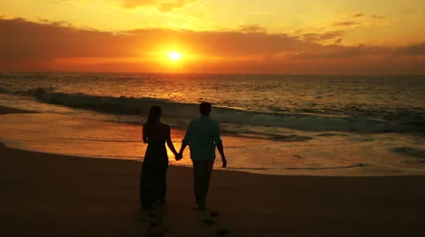 A Couple Walking on the Beach · Free Stock Photo