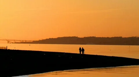 Couple walking on beach Stock Footage 113781